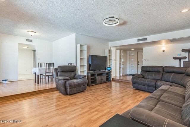 3833 W Phelps Rd, Phoenix, AZ 85053 - living area with wood finished floors and a textured ceiling