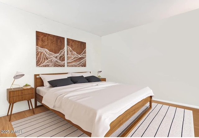 bedroom with light hardwood / wood-style flooring