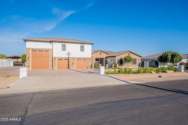 view of front of home featuring concrete driveway and a garage