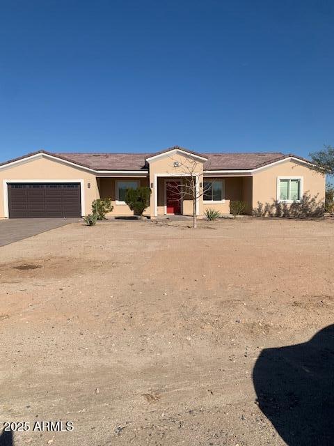 2319 N 192nd Ave, Buckeye, AZ 85396 - single story home featuring stucco siding, concrete driveway, and a garage