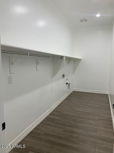 2319 N 192nd Ave, Buckeye, AZ 85396 - laundry area featuring hookup for a gas dryer, laundry area, baseboards, dark wood-type flooring, and hookup for a washing machine