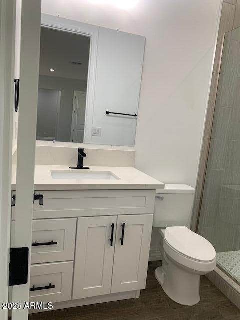 2319 N 192nd Ave, Buckeye, AZ 85396 - bathroom featuring vanity, toilet, and a shower stall