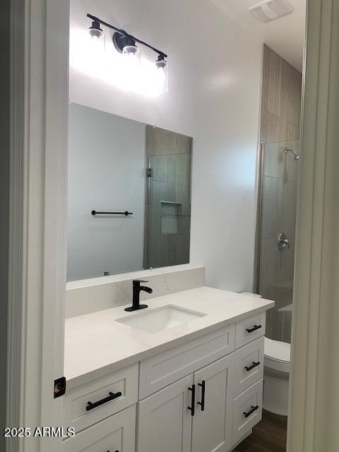 2319 N 192nd Ave, Buckeye, AZ 85396 - bathroom featuring a shower, toilet, vanity, and visible vents
