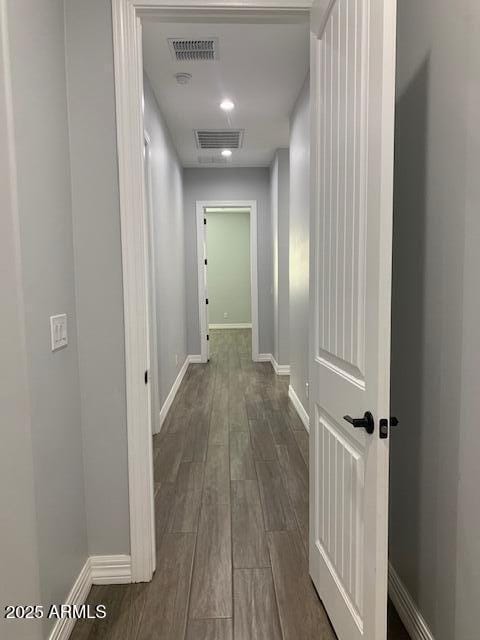 2319 N 192nd Ave, Buckeye, AZ 85396 - hallway with baseboards, visible vents, and dark wood finished floors