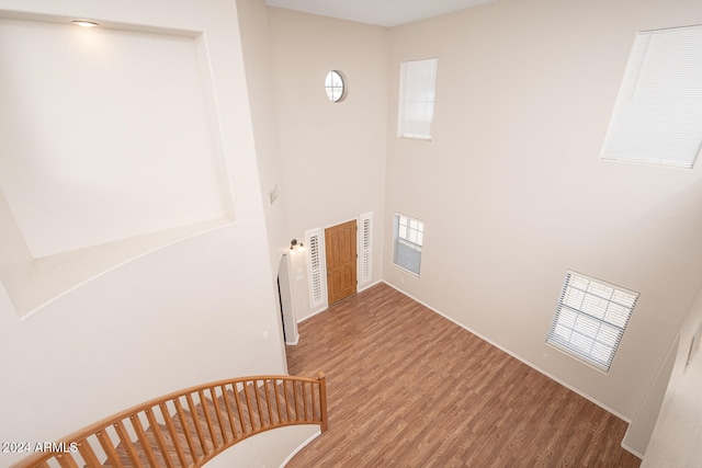 staircase with wood-type flooring