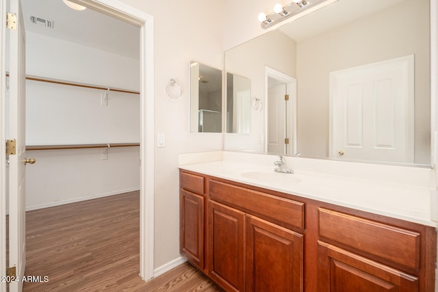 bathroom featuring hardwood / wood-style floors and vanity