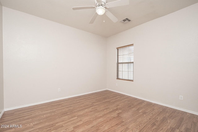 unfurnished room featuring ceiling fan and light hardwood / wood-style floors