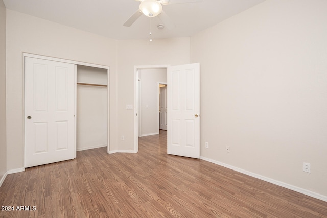 unfurnished bedroom with a closet, ceiling fan, and hardwood / wood-style floors