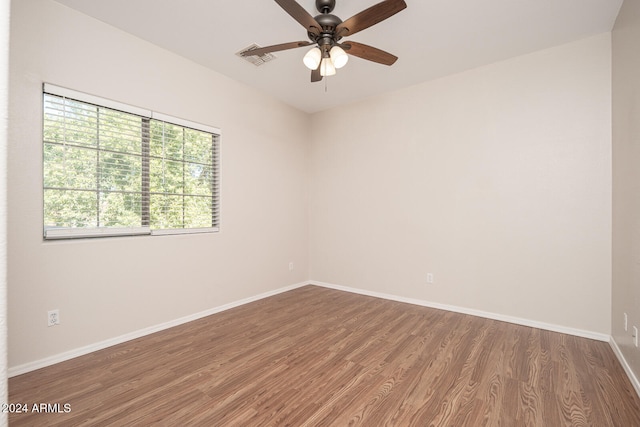 empty room with ceiling fan and wood-type flooring