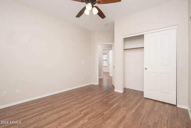 unfurnished bedroom with a closet, ceiling fan, and hardwood / wood-style floors