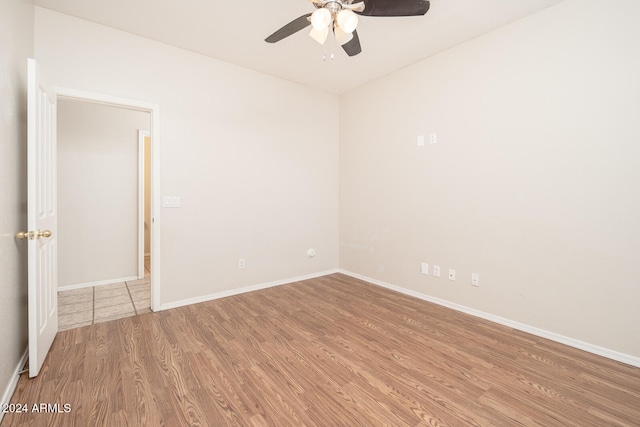 spare room featuring ceiling fan and wood-type flooring