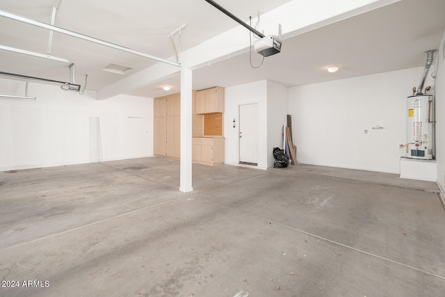 garage featuring a garage door opener and water heater