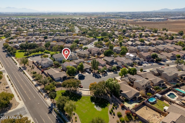 birds eye view of property with a mountain view