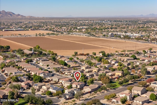 birds eye view of property with a mountain view