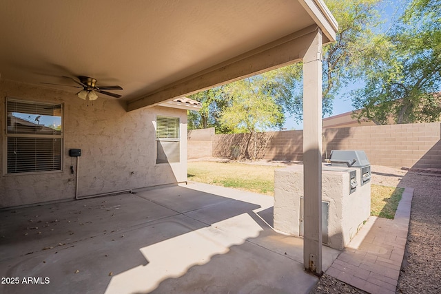 view of patio / terrace with ceiling fan and a fenced backyard