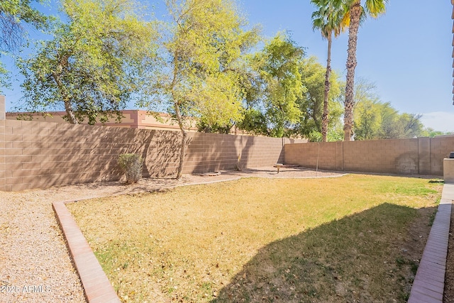 view of yard featuring a fenced backyard