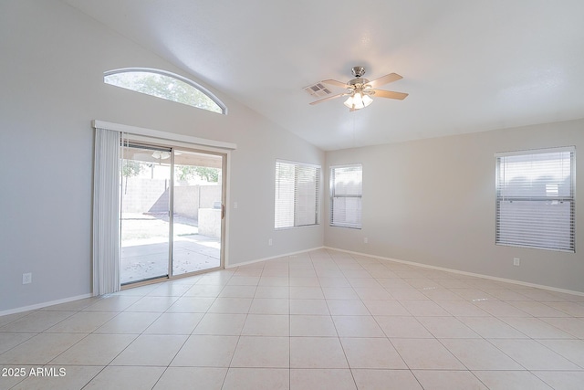 spare room featuring light tile patterned floors, a ceiling fan, visible vents, and baseboards