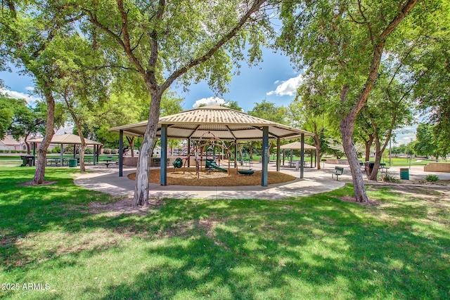 view of property's community featuring a gazebo, a lawn, and playground community