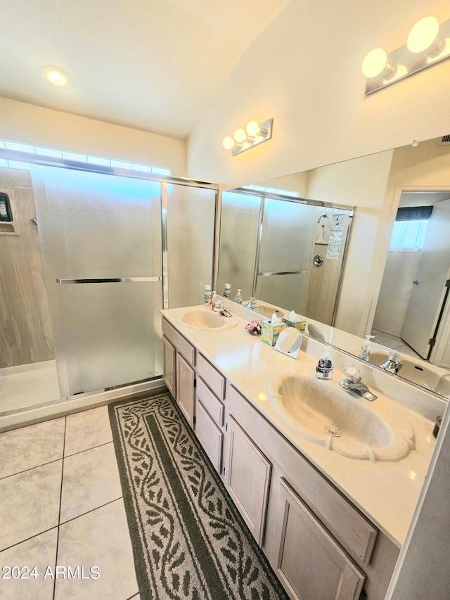 bathroom with vanity, tile patterned floors, an enclosed shower, and lofted ceiling