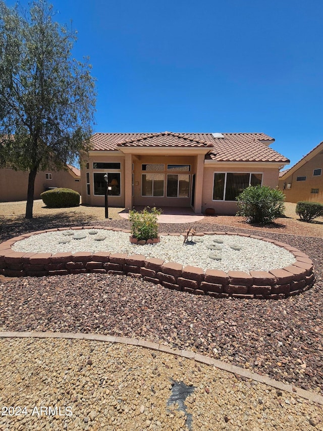 back of property featuring a patio