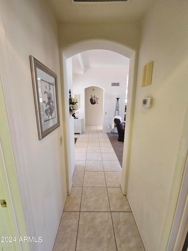 hallway with light tile patterned floors