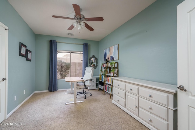 carpeted home office with ceiling fan