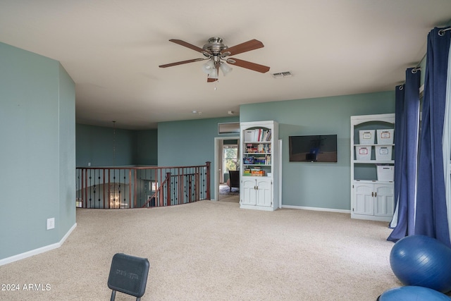 interior space with carpet and ceiling fan