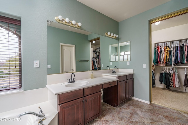 bathroom featuring vanity and a bathtub