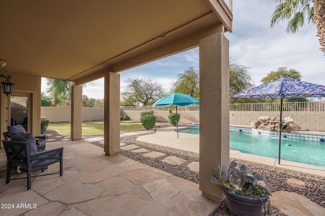 view of patio / terrace featuring a fenced in pool