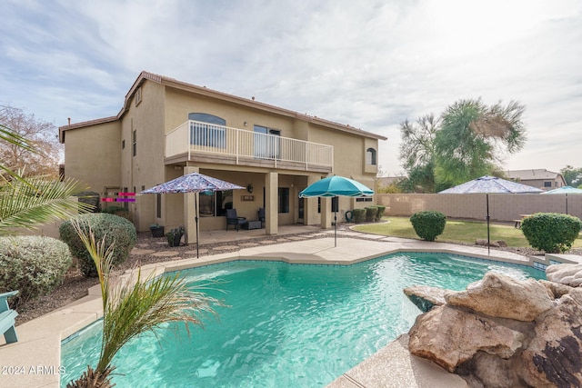 view of swimming pool with a patio area