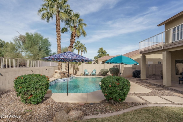 view of swimming pool with a patio area