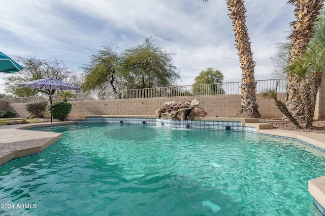 view of swimming pool featuring pool water feature