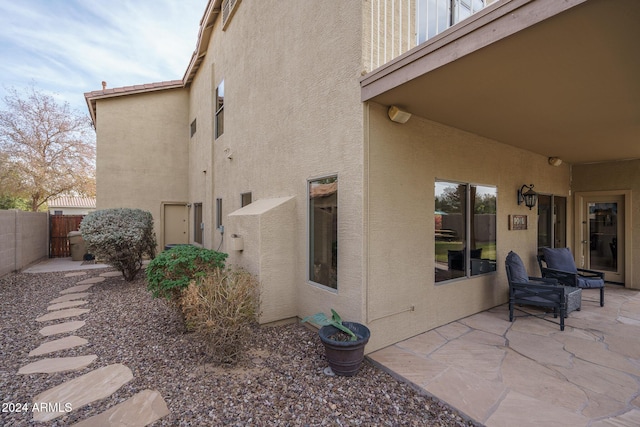 view of side of property with a patio