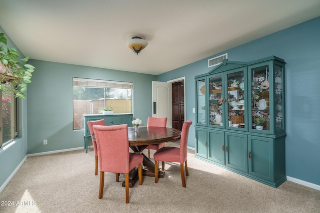 view of carpeted dining space