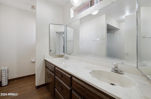 bathroom featuring wood-type flooring and vanity