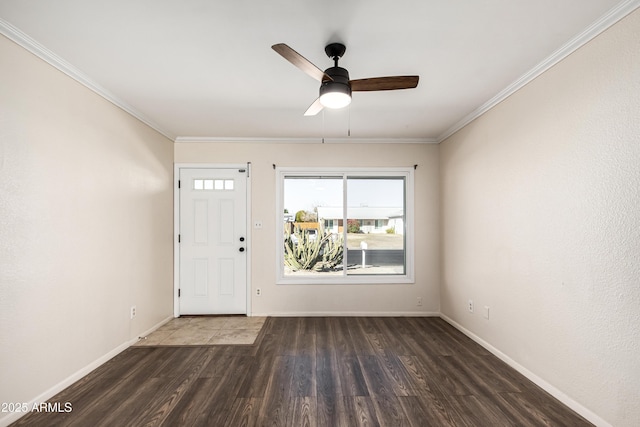 entryway with ceiling fan, dark hardwood / wood-style floors, and ornamental molding