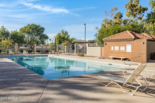 view of swimming pool featuring a patio area