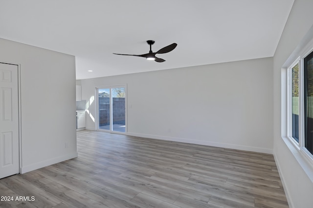 spare room with ceiling fan and light hardwood / wood-style floors