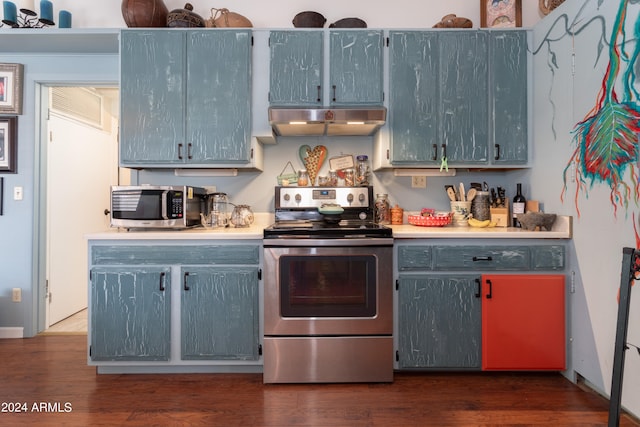 kitchen featuring dark wood-type flooring and appliances with stainless steel finishes