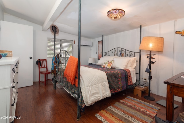 bedroom with a wall unit AC, vaulted ceiling with beams, and dark hardwood / wood-style floors