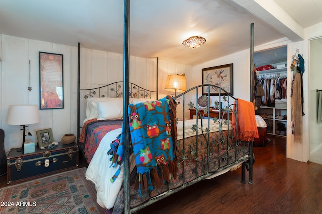 bedroom featuring a closet and dark wood-type flooring