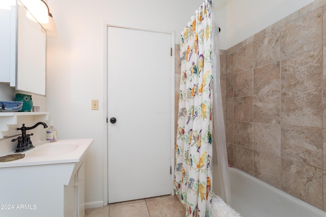 bathroom featuring tile patterned floors, vanity, and shower / bath combo with shower curtain