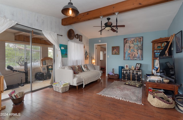 living room featuring hardwood / wood-style floors, vaulted ceiling with beams, and ceiling fan