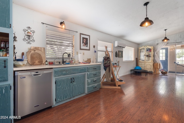 kitchen featuring dark hardwood / wood-style flooring, stainless steel dishwasher, sink, an AC wall unit, and hanging light fixtures