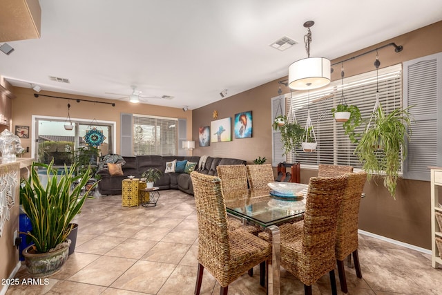 dining room featuring light tile patterned floors, ceiling fan, and visible vents