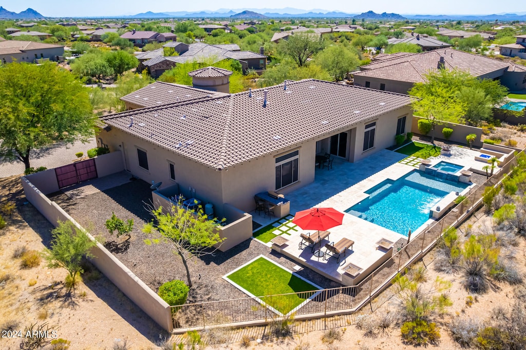 view of swimming pool featuring a mountain view and a patio area