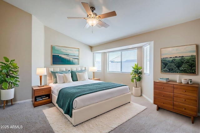 43205 W Oster Dr, Maricopa, AZ 85138 - bedroom with light carpet, vaulted ceiling, baseboards, and a ceiling fan