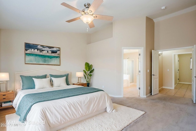 43205 W Oster Dr, Maricopa, AZ 85138 - tiled bedroom with carpet, baseboards, ensuite bathroom, a ceiling fan, and high vaulted ceiling