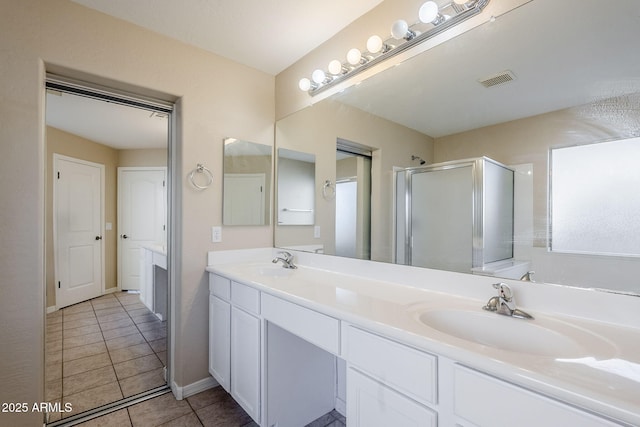 43205 W Oster Dr, Maricopa, AZ 85138 - bathroom with double vanity, a stall shower, and tile patterned flooring