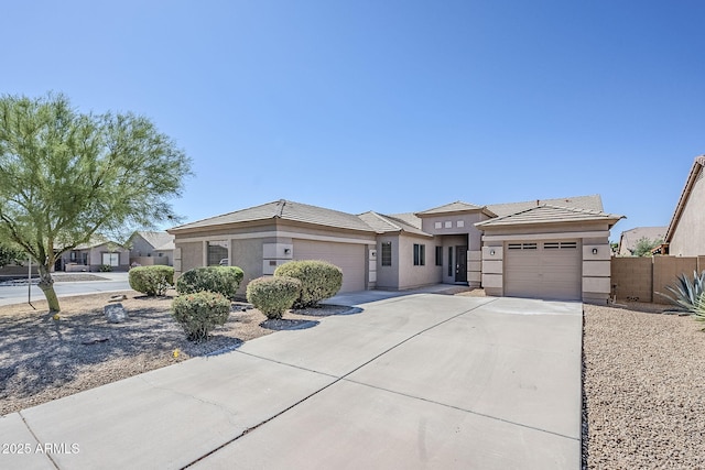 43205 W Oster Dr, Maricopa, AZ 85138 - prairie-style house with driveway, a garage, and stucco siding